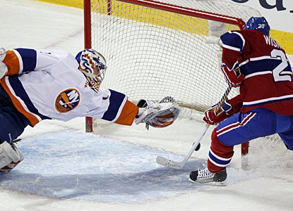 Mikko Koskinen makes a superb diving save on what looks like a sure goal by James Wisniewski. (AP)