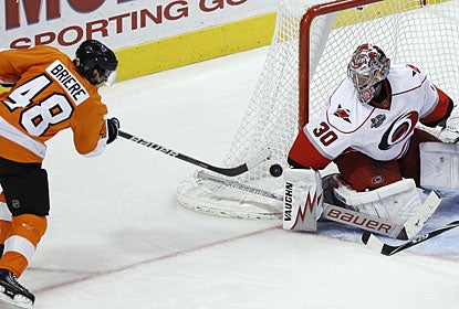 Danny Briere goes top shelf on goalie Cam Ward's short-side for what turns out to be the winning goal. (AP)