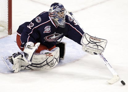 Mathieu Garon makes one of his 31 saves in his first start in over two weeks as the Blue Jackets beat the Avalanche. (AP)