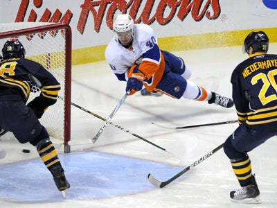 The Islanders' Michael Grabner scores his first of three goals on this tricky wrap-around shot.  (Getty Images)