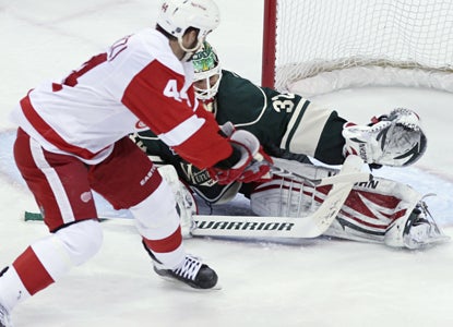 Todd Bertuzzi scores a shootout goal on Wild goalie Niklas Backstrom to give the Red Wings the win  (AP)
