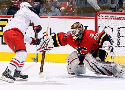 Calgary's Miikka Kiprusoff stops Matt Calvert on a penalty shot in the second period. (Getty Images)