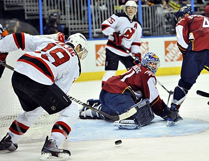Travis Zajac's second power-play goal of the game catches goalie Ondrej Pavelec out of position. (AP)