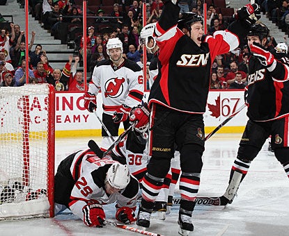 Chris Neil celebrates his first goal of the night and what turns out to be the eventual winner. (Getty Images)