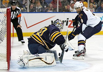 Ryan Miller denies Evander Kane on this penalty shot and finishes with 28 saves for his 30th win this season. (US Presswire)