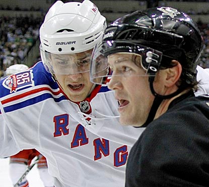 Matt Cooke (right) helps the Rangers when he nails Ryan McDonagh (left) with an elbow that leads to a five-minute power play. (AP)