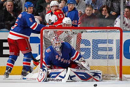 Henrik Lundqvist is not tested too much on the 22 saves he makes for his league-leading 10th shutout. (Getty Images)