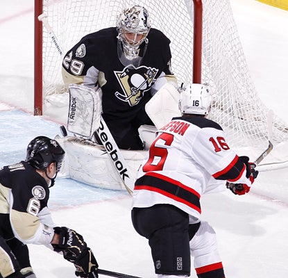 Penguins goalie Marc-Andre Fleury makes a stop on Jacob Josefson for one of his 21 saves against the Devils. (AP)