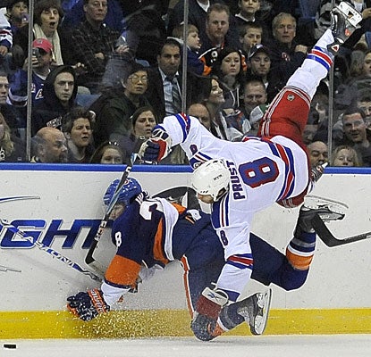 The game has enough goals, four fights, game misconducts and plenty of roughness as displayed by Jack Hillen and Brandon Prust. (AP)