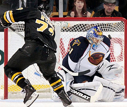 Michael Ryder finds room over Ondrej Pavelec's shoulder to score the go-ahead goal for the Bruins.  (AP)