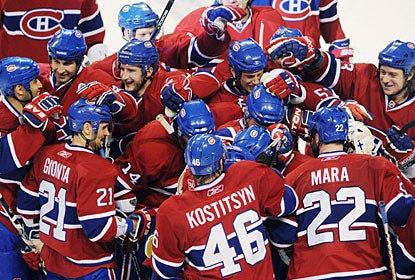 Somewhere in this sea of red is P.K. Subban, who is mobbed after scoring the deciding goal 79 seconds into overtime. (AP)