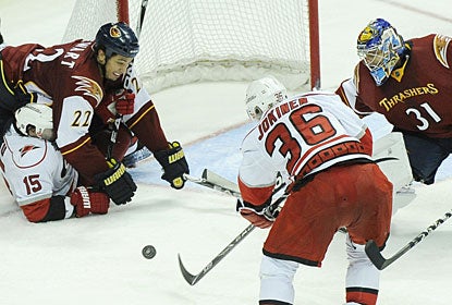 Jussi Jokinen has a pretty easy time to score as goalie Ondrej Pavelec is caught out of position. (AP)