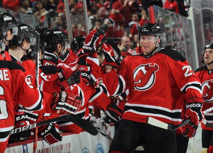 Alexander Urbom celebrates with teammates after scoring the eventual game-winner in the third against the Bruins. (Getty Images)