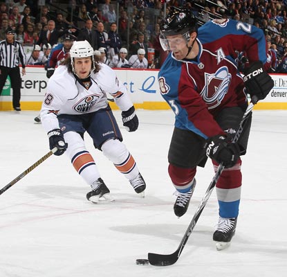 Milan Hejduk (right) records two points against the Oilers during the Avs' season closer.  (Getty Images)