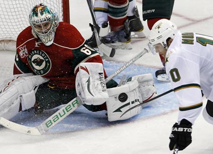 Wild netminder Jose Theodore makes 26 crucial saves, including this one against Dallas LW Brenden Morrow. (Getty Images)
