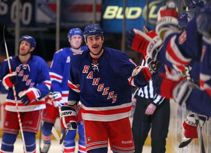 Brandon Dubinsky celebrates with teammates after scoring the game-winning goal with 1:39 left in the third period. (Getty Images)