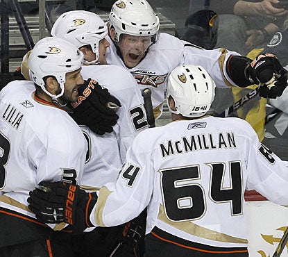 Corey Perry's (top) short-handed goal 77 seconds into the third breaks the 3-3 tie and turns out to be the winner for Anaheim. (AP)