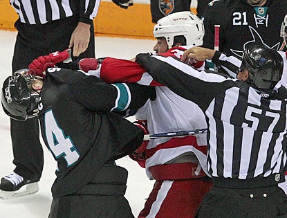 Marc-Edouard Vlasic (left) and Todd Bertuzzi draw roughing penalties in the first period. (AP)