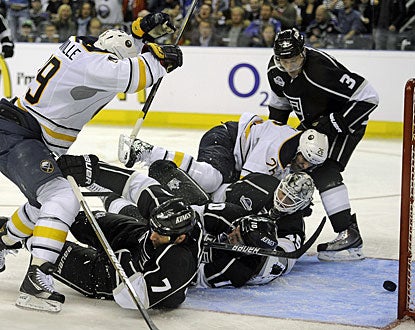 The Kings' defensive core is unable to prevent the puck from going in for one of Luke Adam's (not pictured) goals. (AP)