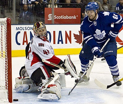 Phil Kessel puts Toronto up 4-0 with his second goal before later completing his hat trick with the winning goal. (AP)