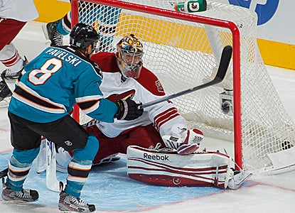 Joe Pavelski scores a first-period goal against Mike Smith of the Coyotes.  Pavelski nets two goals on the night. (Getty Images)