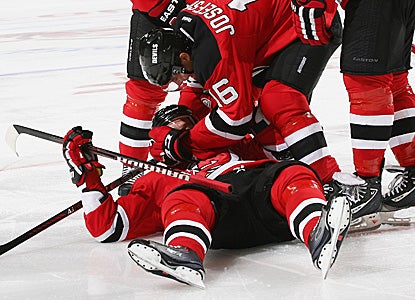 Ilya Kovalchuk, lying on the ice, celebrates with teammates after scoring the deciding goal. (Getty Images)