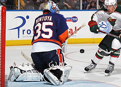 Al Montoya sends back one of his 20 saves on the night to help the Islanders win 2-1 versus the Wild. (Getty Images)