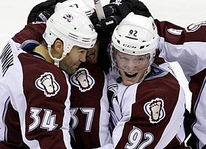 Avs' Gabriel Landeskog (right) celebrates his first career goal with 40 seconds left. (AP)