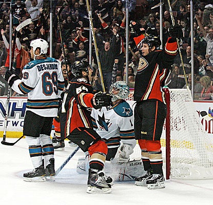 Center Maxime Macenauer (right) celebrates in the first period after scoring on Sharks goalie Thomas Greiss. (Getty Images)