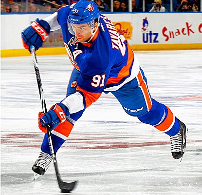John Tavares enjoys a hat trick -- including the game-tying goal -- and adds an assist against the Rangers (Getty Images)
