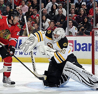 Goalie Tim Thomas allows two scores by the Blackhawks, but makes 27 saves in Boston's road win. (Getty Images)