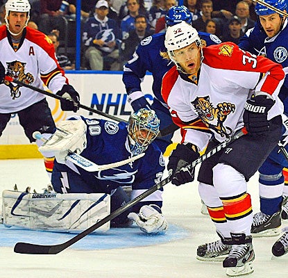 Kris Versteeg (right) scores two goals and adds a pair of assists for the Panthers.  (AP)