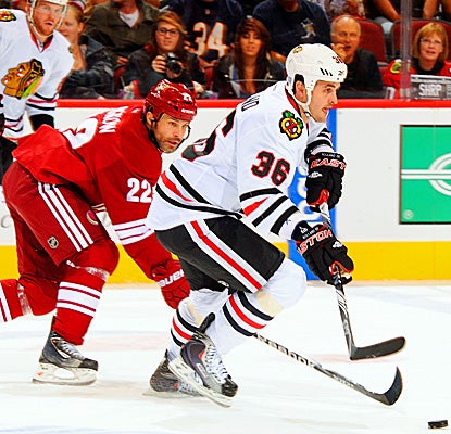 Chicago's Dave Bolland defends the puck against the Coyotes, scoring one goal and one assist. (Getty Images)