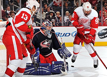 Goalie Steve Mason rebounds from being shaken up early to send away 30 shots for the Jackets in an upset. (Getty Images)