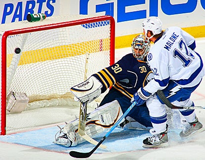 The Lightning's Ryan Malone shoots the game-winning goal against the Sabres' Ryan Miller in the third period.  (Getty Images)