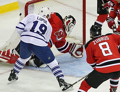 Joffrey Lupul welcomes Martin Brodeur back to action in a rude manner -- scoring three goals in 7:22 in the second period. (US Presswire)