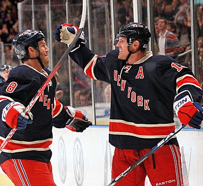 Brad Richards (right) celebrates his goal late in the second period with Brandon Prust. (Getty Images)