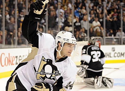 Chris Kunitz scores the tying goal and later adds the deciding tally to lead the Penguins to victory in a shootout. (Getty Images)