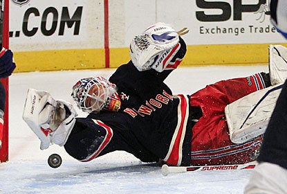It looks like the puck is going in, but it's not. Martin Biron makes one of 23 saves for his first shutout in two years. (AP)
