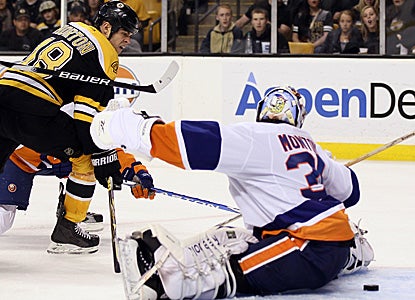 Nathan Horton scores two goals and adds an assist to help the defending champs rout the Islanders. (Getty Images)