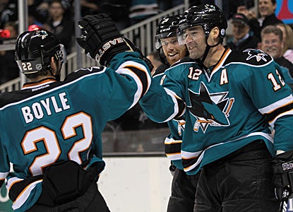 Patrick Marleau (12) gets props from his teammates after scoring in the second period. (Getty Images)