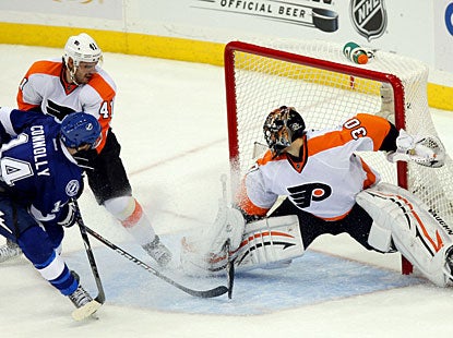 Brett Connolly puts the puck past goalie Ilya Bryzgalov halfway through overtime to lift the Lightning. (US Presswire)