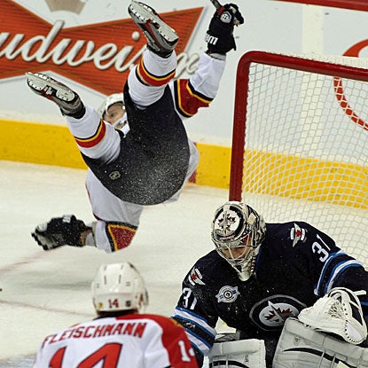 Kris Versteeg is knocked upside-down on this play, but he eventually finishes with three goals against the Jets. (Getty Images)