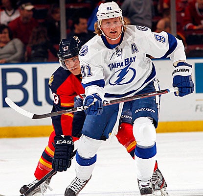 Steven Stamkos (right) scores a power-play goal in OT against the Panthers to end Tampa Bay's two-game losing streak. (Getty Images)