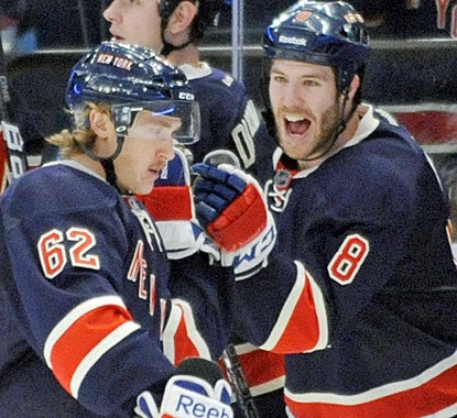 Brandon Prust (8) congratulates 23-year-old Carl Hagelin (62) who records his first NHL goal. (AP)
