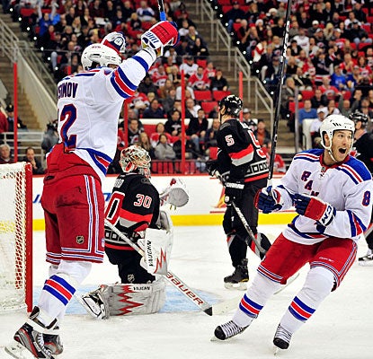 Artem Anisimov and Brandon Prust (8) celebrate Ryan McDonagh's (not pictured) goal. (Getty Images)