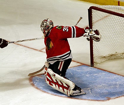 Radim Vrbata (not shown) slips the puck past Ray Emery to help Phoenix prevail in the shootout. (AP)