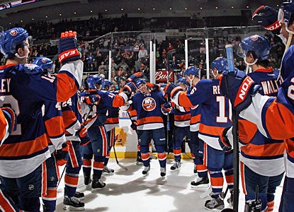 Teammates cheer 22-year-old David Ullstrom, who gets the first star of the game after scoring his first NHL goal. (Getty Images)