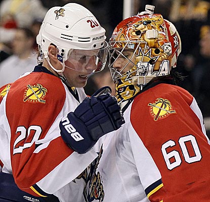 Panthers goalie Jose Theodore is congratulated after he stops 40 shots in shutting out the Bruins. (Getty Images)