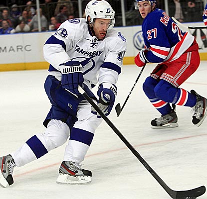 Dominick Moore scores the only goal in the shootout to push the Lightning to a win. (AP)